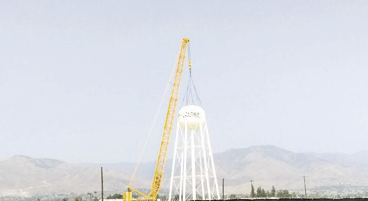 The water tower comes down